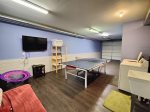 Heated Garage with Ping Pong Table and Washer and Dryer